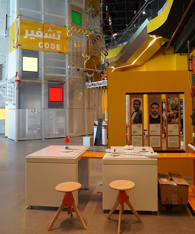 Bilingual exhibition signage and interactive stations at a science center